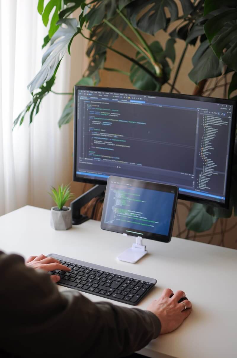 Developer writing code to build a custom, responsive website